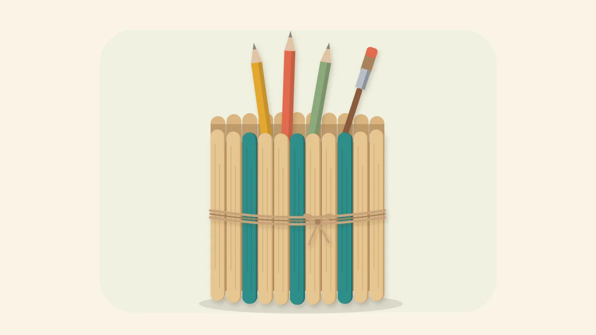 Round popsicle stick pencil holder with teal accent sticks and a twine band holding pencils